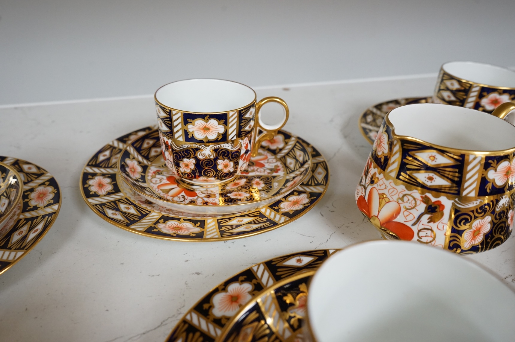 A Royal Crown Derby Imari pattern part tea service to include trios, bowl and jug